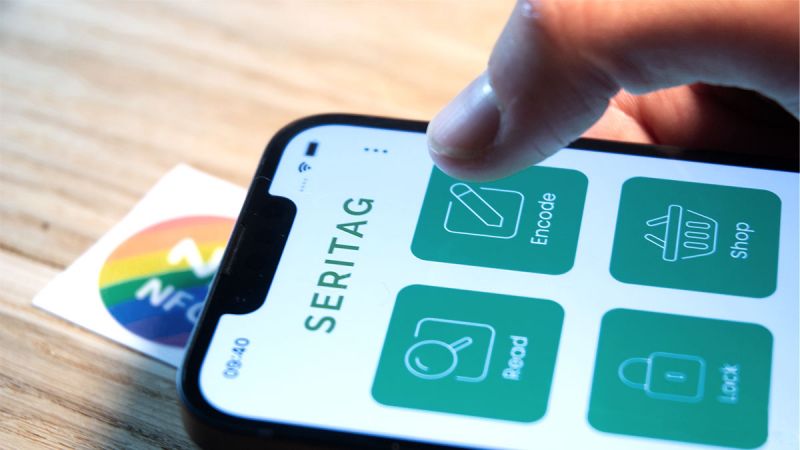 iphone held in hand with open encoding app