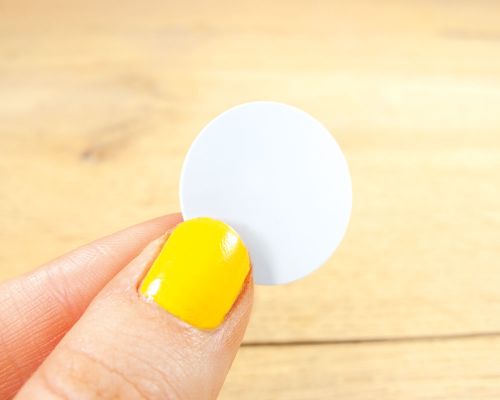 Close up image of an NFC 25mm PVC Disc NTAG424