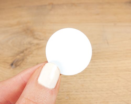 Close up image of an NFC 28mm Tamper Tag NTAG424