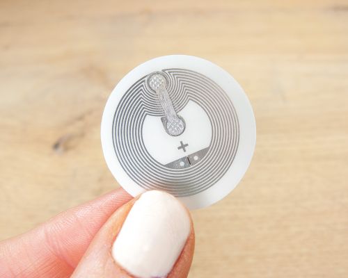 Detail of an NFC 28mm Tamper Tag NTAG424