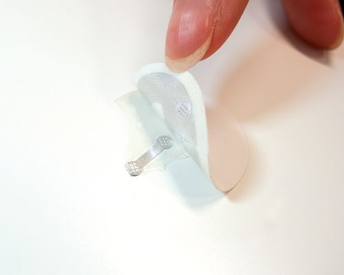 Side view of the NFC 28mm Tamper Tag NTAG424