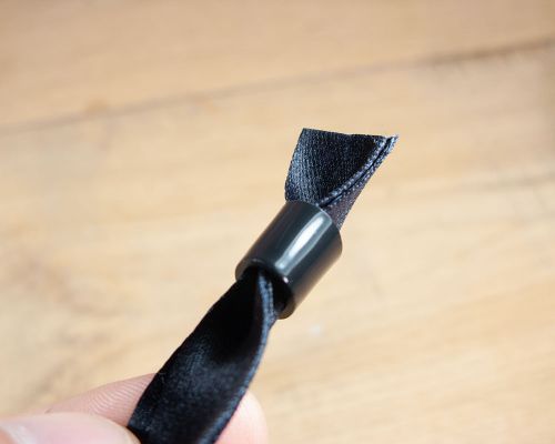 Detail of an NFC Black Fabric Stock Wristband