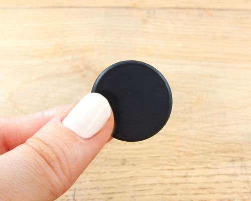 Close up image of an NFC 26mm PPS Disc Tag NTAG424