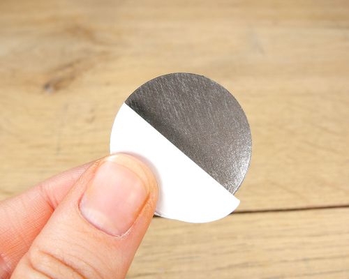 Close up image of an NFC Custom Print NFC Bubble Labels On-Metal