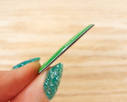 Close up image of an NFC Custom Print On-Metal Bubble Disc Tags