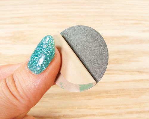 Detail of an NFC Custom Print On-Metal Bubble Disc Tags