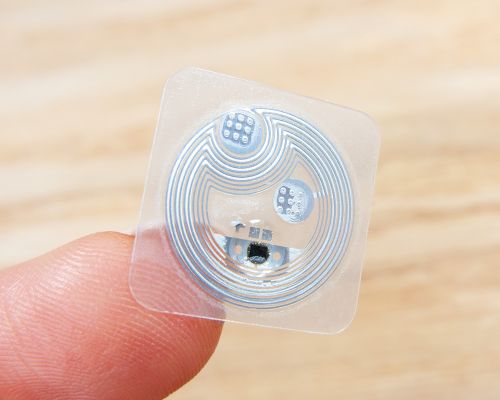 Close up image of an NFC 16mm Square Garment NTAG213