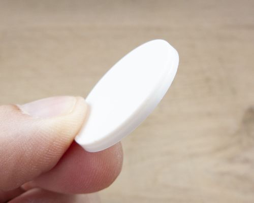 Close up image of an NFC 30mm White ABS Disc